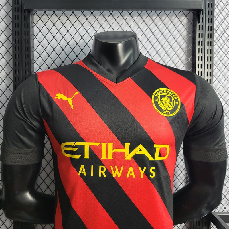 CAMISA VERSÃO PLAYER DO MANCHESTER CITY 22/23 VERMELHO E PRETO